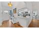 Bright entryway with hardwood floors and view to kitchen at 8692 Vesta Ter, Orlando, FL 32825