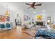 Living area with hardwood floors, fireplace and ample natural light at 8692 Vesta Ter, Orlando, FL 32825