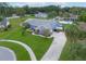 Housetop view of home showing driveway and yard at 8692 Vesta Ter, Orlando, FL 32825