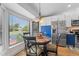 Kitchen nook with a round table and chairs, offering a view of the backyard at 8692 Vesta Ter, Orlando, FL 32825