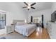 Main bedroom with king-size bed and access to lanai at 8692 Vesta Ter, Orlando, FL 32825
