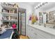 Bathroom with a vanity, shelves, and a folding screen at 8692 Vesta Ter, Orlando, FL 32825