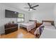 Bedroom with two twin beds, a desk, and ceiling fan at 8692 Vesta Ter, Orlando, FL 32825