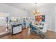 Elegant dining room with hardwood floors and a chandelier at 8692 Vesta Ter, Orlando, FL 32825