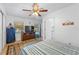 Spacious bedroom with a striped bedspread and ceiling fan at 8692 Vesta Ter, Orlando, FL 32825
