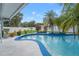 Refreshing kidney-shaped pool surrounded by tropical landscaping at 8692 Vesta Ter, Orlando, FL 32825