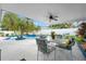 Relaxing poolside patio set under covered patio with ceiling fan at 8692 Vesta Ter, Orlando, FL 32825
