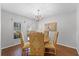 Formal dining room with a round table and four patterned chairs at 2134 Osprey Woods Cir, Orlando, FL 32820