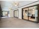 Spacious screened porch with sliding glass doors and ceiling fans at 1469 Grace Lake Cir, Longwood, FL 32750