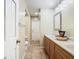 Long bathroom with double vanity and a toilet at 1469 Grace Lake Cir, Longwood, FL 32750