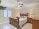 Bedroom with a full-size bed and wooden furniture at 1469 Grace Lake Cir, Longwood, FL 32750