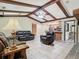 Living room with vaulted ceiling, leather furniture, and fireplace at 1469 Grace Lake Cir, Longwood, FL 32750