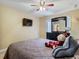 Bedroom with a queen-size bed and dresser at 1469 Grace Lake Cir, Longwood, FL 32750