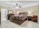 Spacious bedroom with a king-size bed and large dresser at 1469 Grace Lake Cir, Longwood, FL 32750