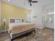 King bedroom with ensuite bathroom access and wood-look floors at 8027 Knee Deep Rd, Kissimmee, FL 34747