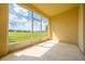 Screened patio with view of green space at 130 Club Villas Ln, Kissimmee, FL 34744