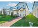 Two-story home with light blue siding, a front porch, and a brick walkway at 11944 Bracco St, Winter Garden, FL 34787