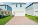 Attached garage with brick paver driveway at 11944 Bracco St, Winter Garden, FL 34787