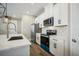 Modern kitchen with stainless steel appliances and an island at 11944 Bracco St, Winter Garden, FL 34787