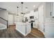 Modern kitchen with stainless steel appliances and white cabinets at 11944 Bracco St, Winter Garden, FL 34787