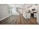 Open-concept kitchen with island and stainless steel appliances at 11944 Bracco St, Winter Garden, FL 34787