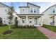 Two-story Craftsman style home with gray siding, brick walkway, and landscaping at 11948 Bracco St, Winter Garden, FL 34787