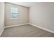 Simple bedroom with carpeted floor and window at 11960 Bracco St, Winter Garden, FL 34787