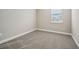 Bright bedroom with carpeted floor and neutral wall paint at 11960 Bracco St, Winter Garden, FL 34787