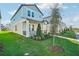 Two-story light blue home with landscaping and a walkway at 11960 Bracco St, Winter Garden, FL 34787