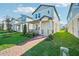 Two story home with light blue siding, walkway, and landscaping at 11960 Bracco St, Winter Garden, FL 34787