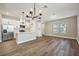 Open concept kitchen with white cabinets and an island at 11960 Bracco St, Winter Garden, FL 34787