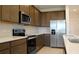 Modern kitchen with stainless steel appliances and island at 14569 Crestavista Dr, Clermont, FL 34714