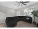 Spacious living room with sectional sofa and large window at 8253 Maritime Flag St # 125, Windermere, FL 34786