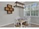 Bright dining area, farmhouse table, window, light fixture at 8253 Maritime Flag St # 125, Windermere, FL 34786