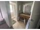 Clean bathroom with shower/tub combo and updated vanity at 2391 Moonstone Ave, Deltona, FL 32738