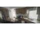 Cozy kitchen featuring wood cabinets and stainless steel appliances at 2391 Moonstone Ave, Deltona, FL 32738