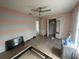 Bedroom with blue and white striped walls and wood-look floors at 2391 Moonstone Ave, Deltona, FL 32738