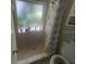 Bathroom with shower stall, toilet and window at 2391 Moonstone Ave, Deltona, FL 32738