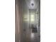 Small bathroom with shower, toilet and exterior access at 2391 Moonstone Ave, Deltona, FL 32738