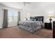 Main bedroom with king-size bed and nightstands at 2940 Nottel Dr, Saint Cloud, FL 34772