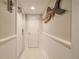 Bright hallway with white walls and wood-look floors at 5303 S Atlantic Ave # 35, New Smyrna Beach, FL 32169