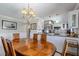 Bright dining room with large table and kitchen access at 5303 S Atlantic Ave # 35, New Smyrna Beach, FL 32169