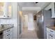 Well-equipped kitchen with granite counters and white cabinets at 5303 S Atlantic Ave # 35, New Smyrna Beach, FL 32169