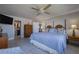 King-size bed, ensuite bathroom, and water views at 5303 S Atlantic Ave # 35, New Smyrna Beach, FL 32169