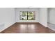 Bright dining room with hardwood floors and large window at 7904 Dunstable Cir, Orlando, FL 32817