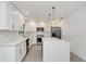 Modern kitchen with white cabinets, quartz countertops, and island at 7904 Dunstable Cir, Orlando, FL 32817