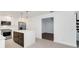 Updated kitchen featuring white cabinetry and a large island at 7904 Dunstable Cir, Orlando, FL 32817