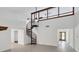 Open living area featuring a spiral staircase and high ceilings at 7904 Dunstable Cir, Orlando, FL 32817