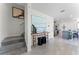 Bright entryway with staircase, console table, and view into the kitchen at 6146 Galloping Dr, Apopka, FL 32712