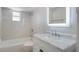 Bathroom with a bathtub, toilet and marble vanity at 5625 Chipola Cir, Orlando, FL 32839